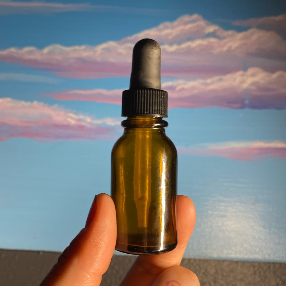 Tiny glass dropper bottle